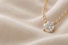 Illustrative close detail of the four-prong setting on ivory fabric
